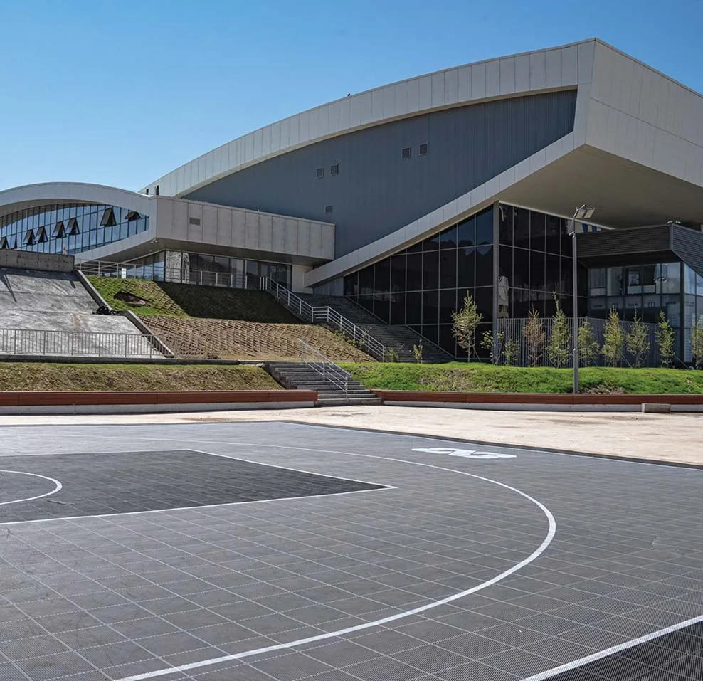 Steppe Arena's exterior with its outdoor basketball court
